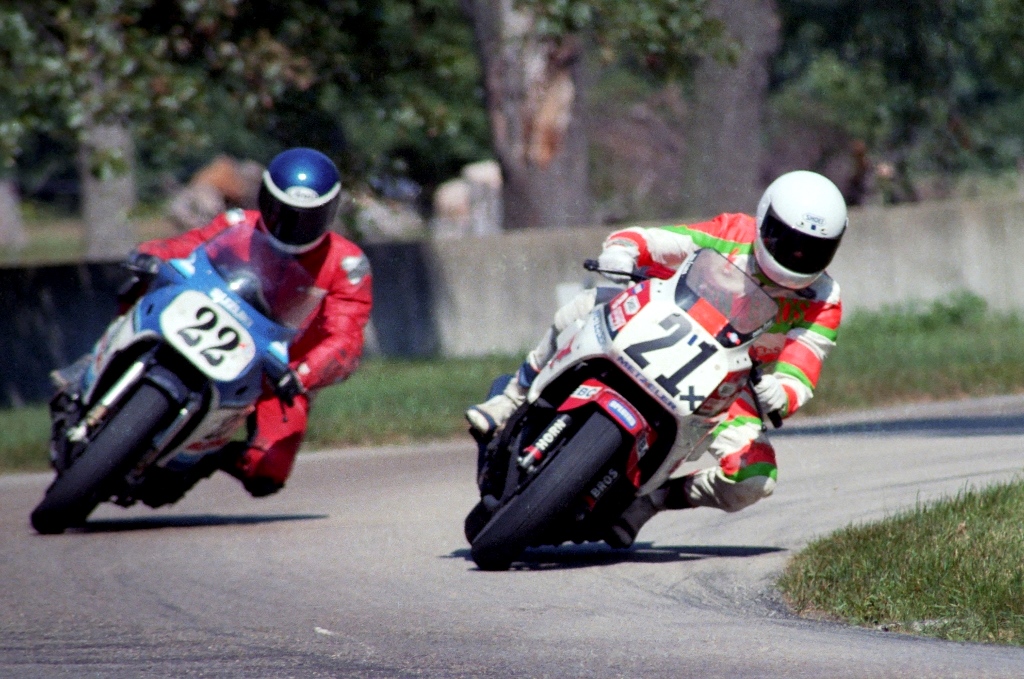 Chris Horn (No. 21) leads Mark Tanner (No. 22) at in a WERA Regional sprint race at Blackhawk Farms Raceway in August of 1986. Horn was one half of the WERA National Endurance team Horn Brothers Racing. Tanner was an intense first-year expert. He went down to Talladega with his Suzuki in March of that year and led most of the B Production (the very first Suzuki GSXR Cup-paying) race before getting passed by Ron Ewerth and eventual winner Doug Polen in the closing laps. (Larry Lawrence photo)