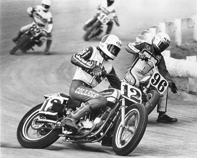 Ted Boody, Jr. (No. 12) takes the high line on his Harley-Davidson XR750 around the York Half-Mile during an AMA regional flat track race in May of 1981. Coming up in second is Billy Schaeffer (No. 96) riding the inside line. Running not far behind in third and fourth are Ricky Campbell (No. 82) and Willie Crabbe (No. 46). (Henny Ray Abrams photo)