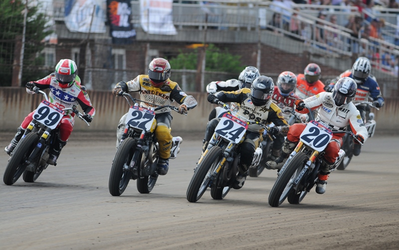 Coming from the outside at the start of a Semi at the May 2010 Springfield Mile, is Larry Pegram (No. 99) on his Ducati North America Foremost Insurance Ducati Hypermotard 1100, then Robert Pearson (No. 27) on his Snedeker Racing, Stratton Racing, WKR Harley-Davidson XR750, Logan Myers (No. 24) on his Motorcyclists Post Harley-Davidson XR750 and on the inside rail Matt Weidman (No. 20) aboard his Memphis Shades, Wiseco, Saddlemen Harley-Davidson XR750. (Larry Lawrence photo)