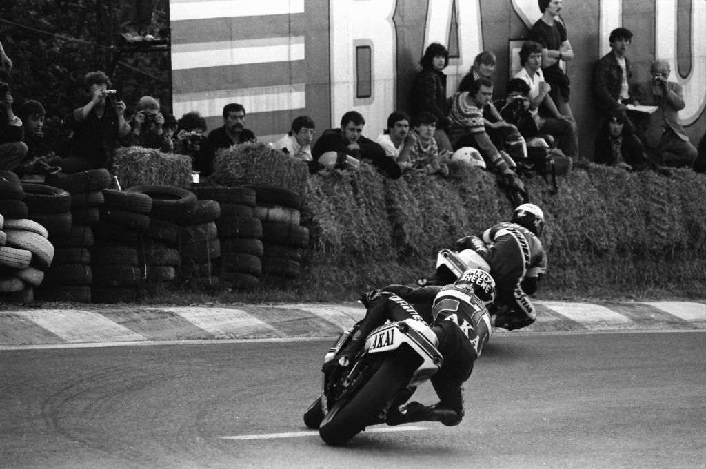 Prior to the litigious decade of the 1980s fans were given a lot more liberties at the races, even the big ones. This photo perfectly illustrates that innocent, albeit somewhat riskier age. Fans casually sit squarely in the impact zone at the 1981 Belgian Grand Prix as Kenny Roberts and Barry Sheene hustle their GP bikes through a turn. (Henny Ray Abrams photo)