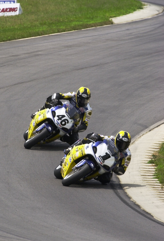 Arclight Racing Suzuki’s Lee Acree and Brian Parriott go wheel to wheel in Formula USA Sportbike action at Virginia International Raceway in July of 2001. (Henny Ray Abrams photo)