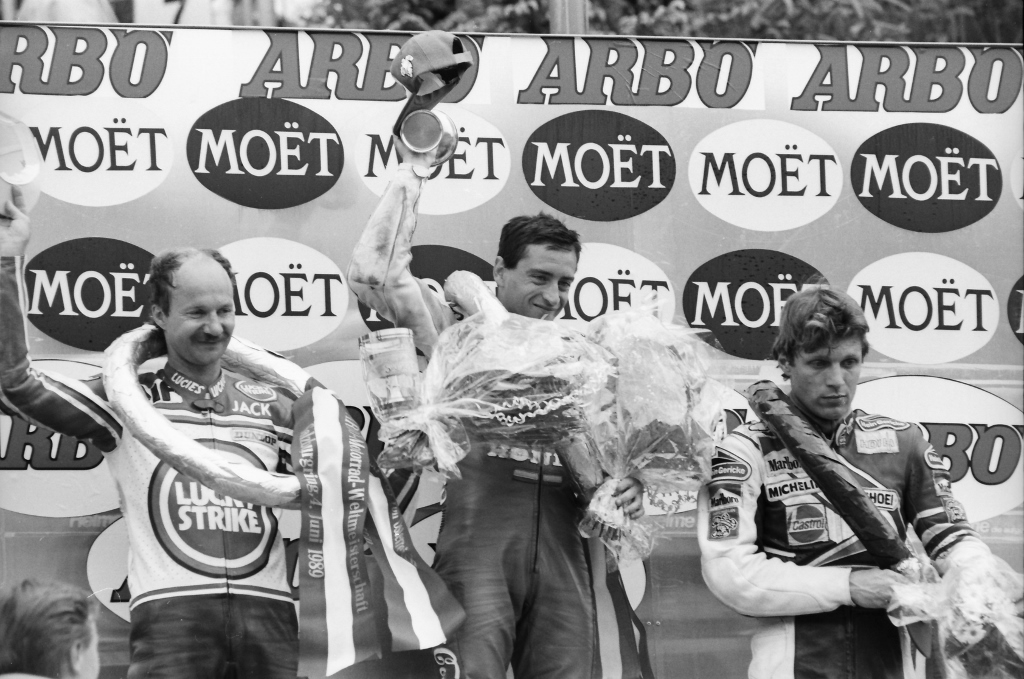 Sito Pons celebrates his victory at the center of the podium after winning the Austrian 250cc Grand Prix in June of 1989. He is joined on the box by second place Jacques Cornu (left) of Switzerland and West Germany’s Martin Wimmer. (Henny Ray Abrams photo)