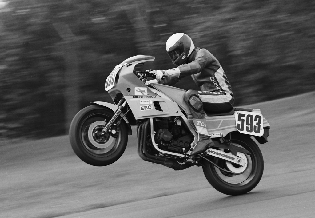 Gene Burcham’s motocross background shows through in this shot of him wheelying his Yamaha FZ600 over the jump at Grattan Raceway at a WERA race in July of 1986. (Larry Lawrence photo/RiderFiles.com)