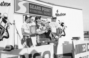 Terry Statum popping the cork after an endurance road race win with Team Sunset at the Sears Point National in 1986. (Larry Lawrence photo)