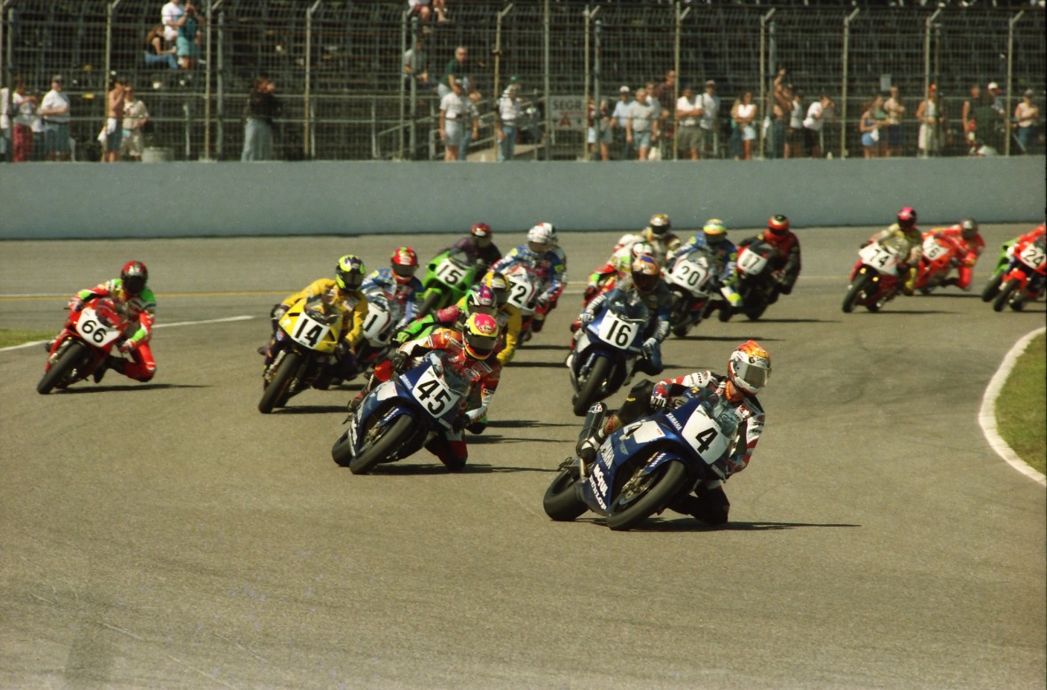This photo shows the start of the 56th Annual Daytona 200 going through turn one at Daytona International Speedway on March 9, 1997. Scott Russell (4) is leading the way on a factory Yamaha YZF750R followed by teammate Colin Edwards (45). (Henny Ray Abrams photo)