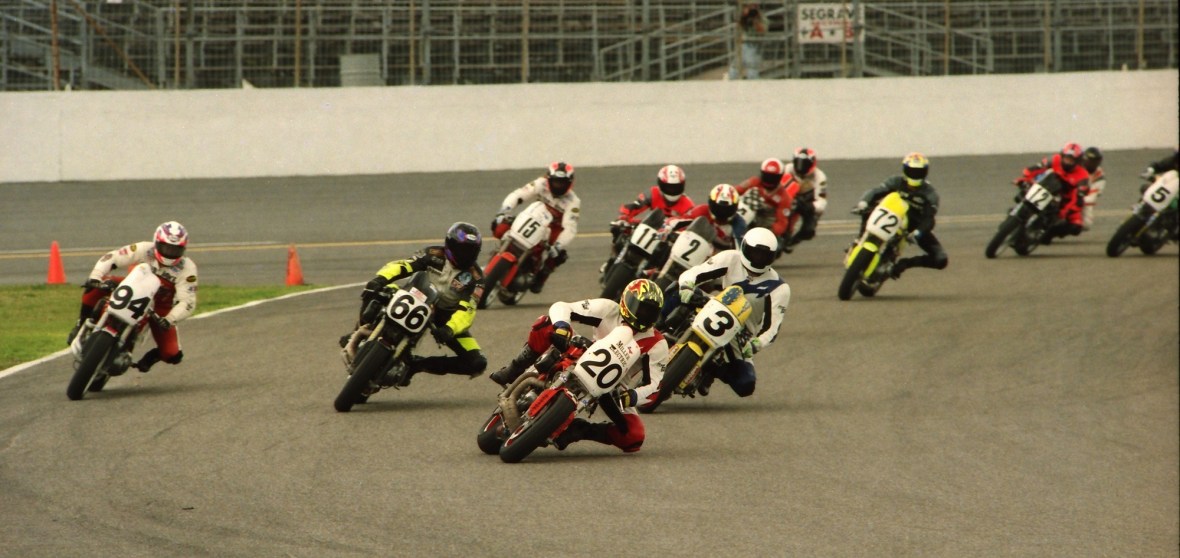 Eric Bostrom (20) leads a field of riders through the first turn in the 1997 NASB Buell Lightning Series race at Daytona in March of 1997. Eric Bostrom (20) leads a field of riders through the first turn in the 1997 NASB Buell Lightning Series race at Daytona in March of 1997. (Henny Ray Abrams Photo)