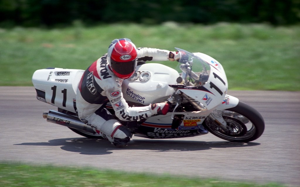 David Stanton looks up the track as he corners the Team Suzuki Endurance II GSXR1100 at Putnam Park Road Course during the WERA Sunoco/Performance Machine National Endurance Series round five in July of 1994. Stanton was just getting his pro career started at this point and he and teammate Steve Patterson finished second overall in the six hour endurance race. Stanton’s racing career ended with a crash in 2013 that left him paralyzed. He continues his recovery to this day. You can keep up with Stanton’s progress and lend your help by contributing to him and his family at the website: http://www.stanton53support.com/blog/  (Larry Lawrence photo)