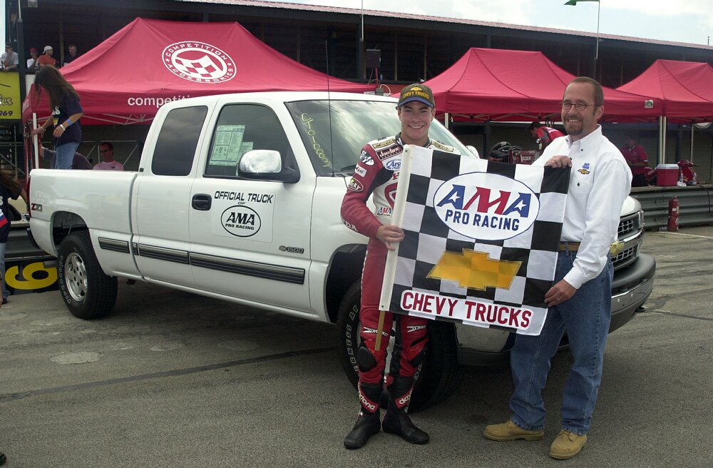 Nicky Hayden picked up the keys to a brand-new Chevy Silverado pickup truck from Chevy's John Farris, Jr., after winning the ‘Like A Rock Challenge’ in the AMA Chevy Trucks U.S. Superbike Championship in 2000. (Henny Ray Abrams photo)