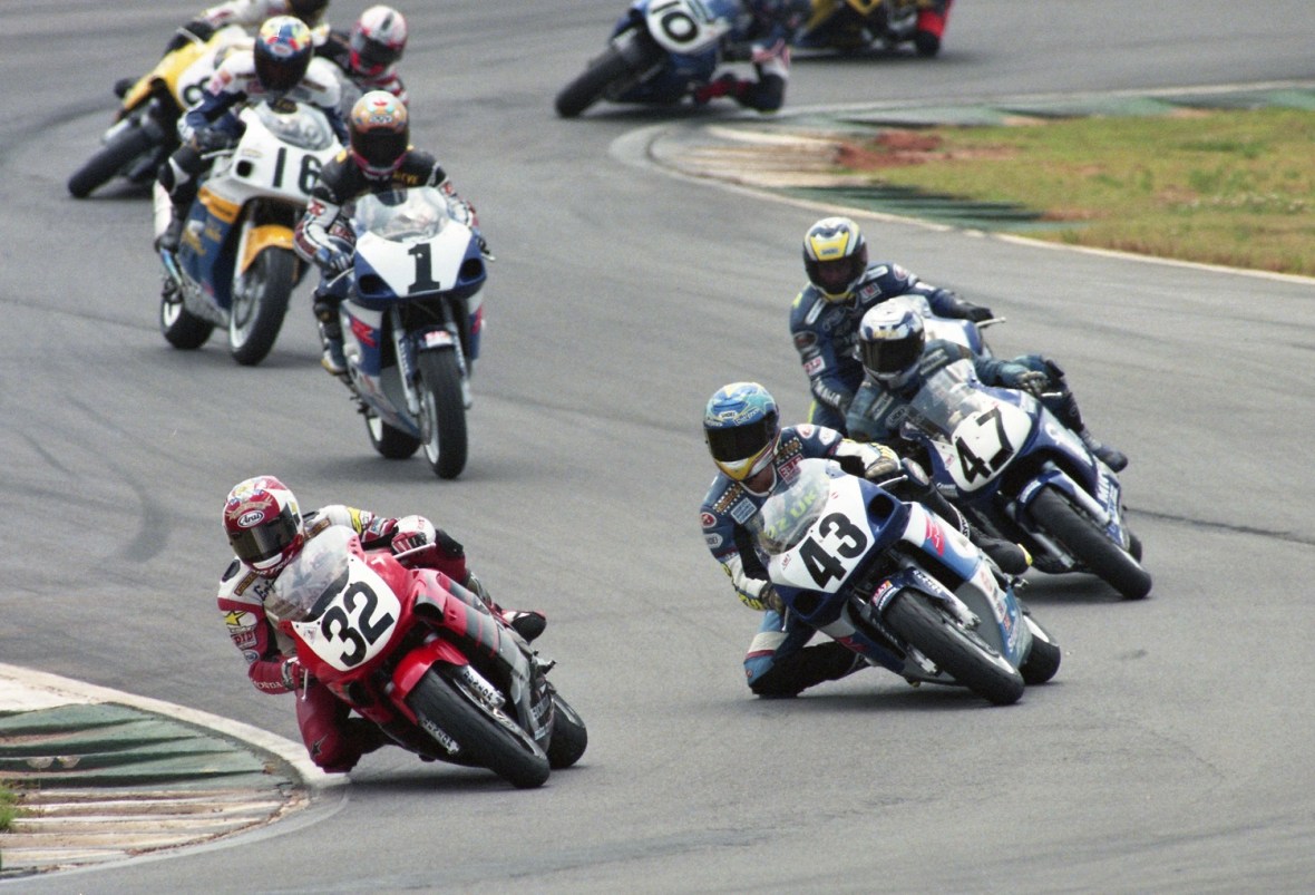 I was struck by the talent level of the rider in this 600 Supersport photo from 1999, especially when I realized this group was racing outside the top-five! The depth of fields in late ‘90s Supersport racing was simply jaw dropping. In this excellent Henny Abrams photo Eric Bostrom (No. 32 factory Honda CBR600F4) leads a group that includes Jason Pridmore (No. 43 Yoshimura Suzuki), Takahito Mori (No. 47), Rich Oliver (No. 97 factory Yamaha), defending series champ Steve Crevier (No. 1 Yoshimura Suzuki), Tom Kipp (No. 16 Chaparral Mazda Suzuki), Owen Weichel (No. 8) and Roland Sands (in the back of the pack on No. 10 Performance Machine Yamaha). (Henny Ray Abrams photo)