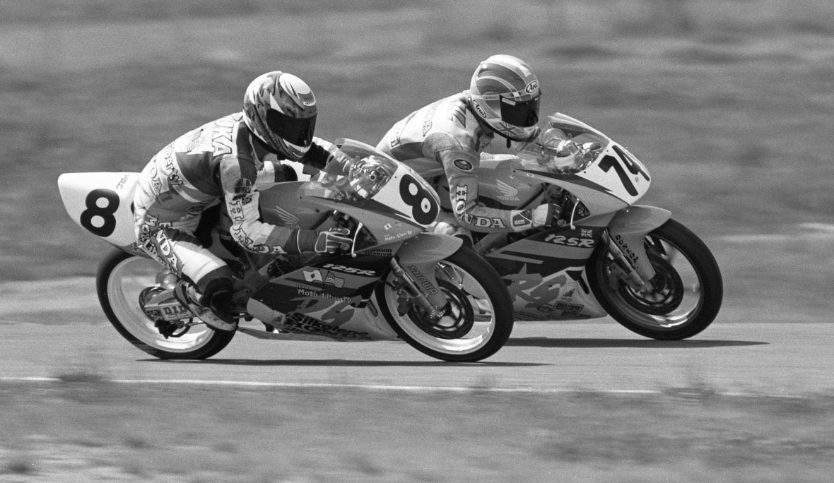 Masahiro Iizuka (No.8) and Vicky Jackson-Bell (No. 74) battle side by side on their Honda RS125Rs at round seven of the NASB International Grand Prix presented by Idemitsu and HRC at Pocono International Raceway. Iizuka went on to win the series title. (Henny Abrams photo)