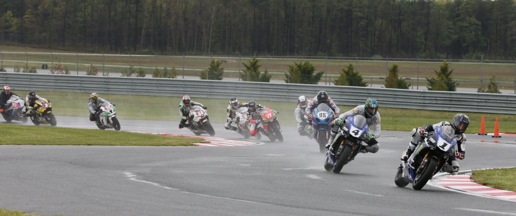 On May 1, Cameron Beaubier (1) sloshed his way to victory over teammate Josh Hayes (4) in both wet races at NJMP. Now he's aiming for his second Superbike title as the series heads back to New Jersey for the finale. Photography by Brian J. Nelson.
