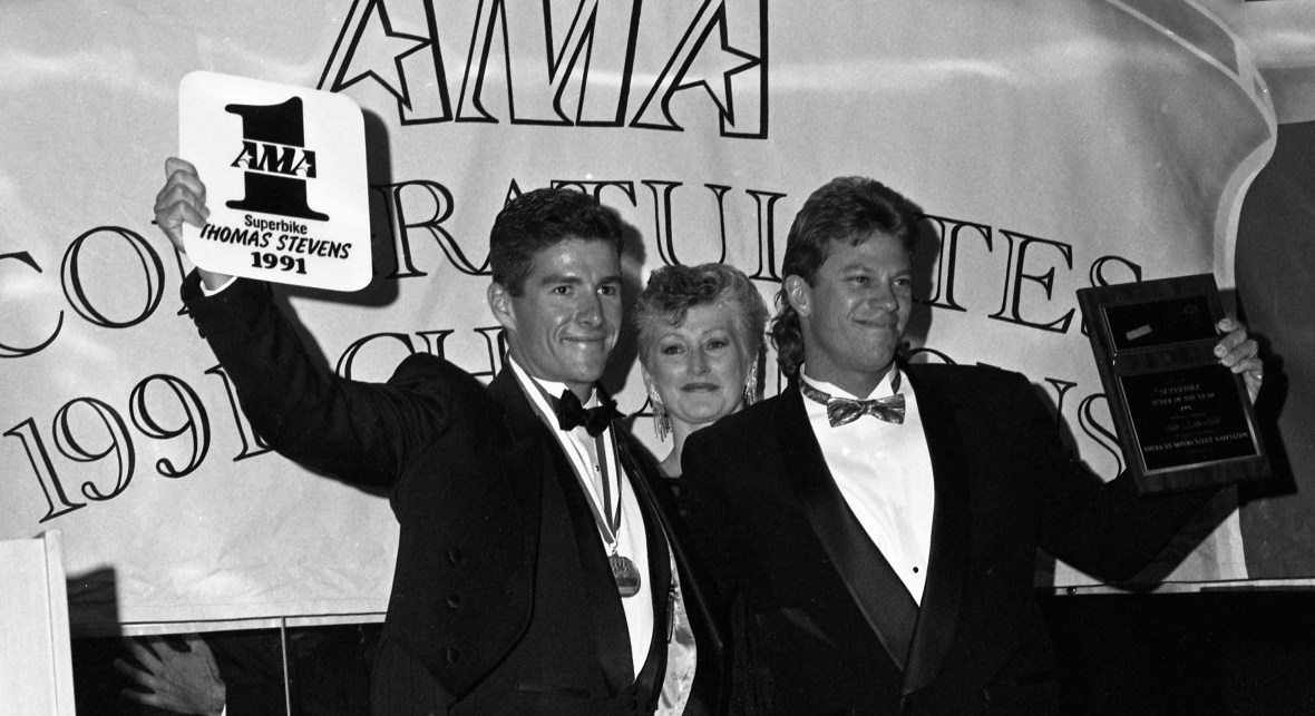 Thomas Stevens is awarded the coveted No. 1 plate for winning the 1991 AMA Superbike Championship, while his mechanic Jim Leonard accepts the AMA’s Tuner of the Year Award at the AMA Pro Racing Awards banquet in Redondo Beach, California, in November of 1991. (Mitch Friedman photo)